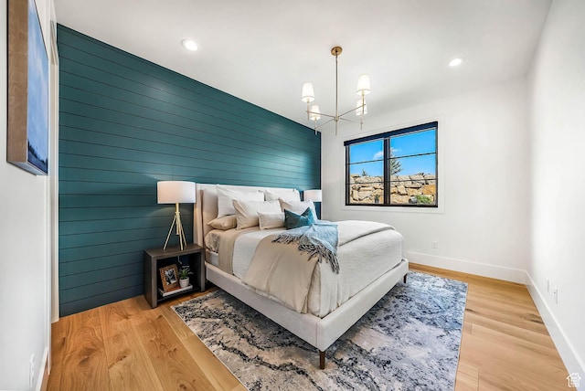 2225 Elk Meadows Cir, Woodland, UT 84036 - bedroom featuring a chandelier, recessed lighting, wood finished floors, and wooden walls