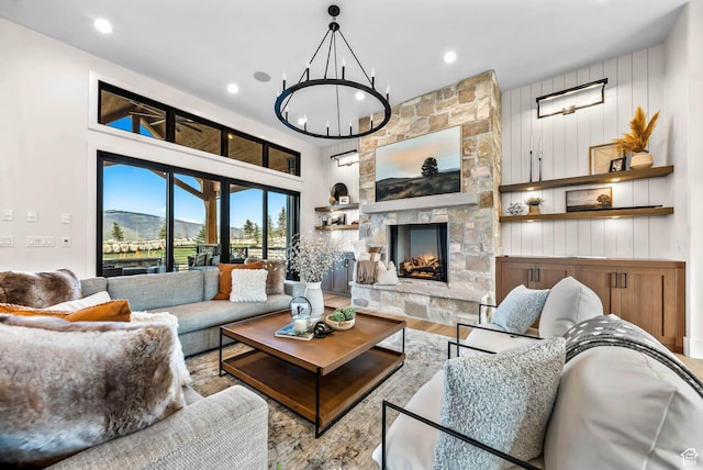 2225 Elk Meadows Cir, Woodland, UT 84036 - living room featuring wood finished floors, a chandelier, a stone fireplace, and recessed lighting