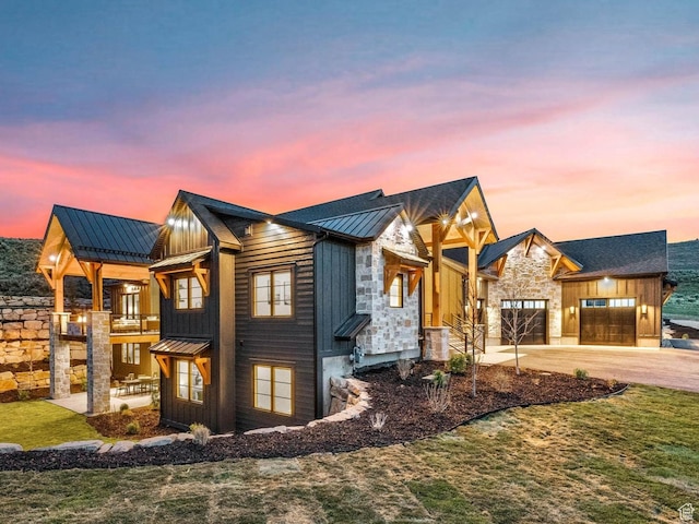 2225 Elk Meadows Cir, Woodland, UT 84036 - modern farmhouse with a standing seam roof, a metal roof, an attached garage, board and batten siding, and driveway
