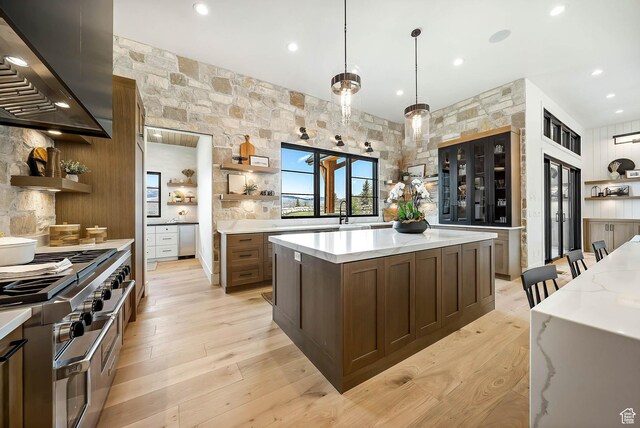 2225 Elk Meadows Cir, Woodland, UT 84036 - kitchen featuring open shelves, wall chimney range hood, range with two ovens, light wood-style flooring, and recessed lighting