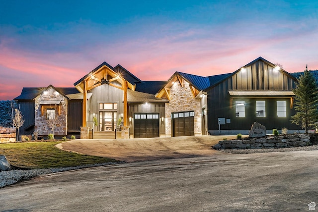 2225 Elk Meadows Cir, Woodland, UT 84036 - modern inspired farmhouse featuring board and batten siding, stone siding, a garage, and driveway