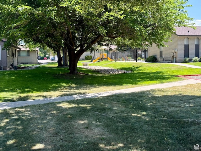 34 S El Dorado Pl, West Jordan, UT 84088 - view of grassy yard featuring a playground