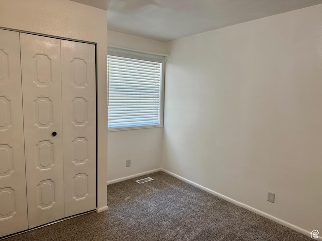 34 S El Dorado Pl, West Jordan, UT 84088 - unfurnished bedroom featuring dark carpet and a closet