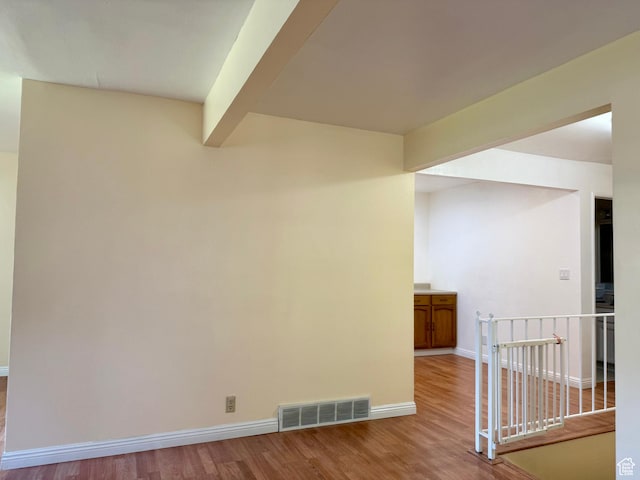 34 S El Dorado Pl, West Jordan, UT 84088 - unfurnished room featuring wood finished floors and beamed ceiling
