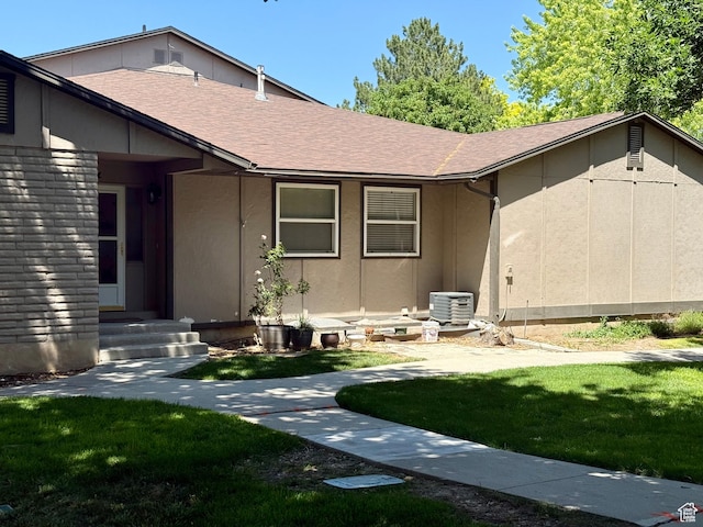 34 S El Dorado Pl, West Jordan, UT 84088 - view of front of property with a front yard, a shingled roof, and entry steps