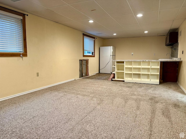 34 S El Dorado Pl, West Jordan, UT 84088 - finished basement with freestanding refrigerator, carpet, a paneled ceiling, and recessed lighting