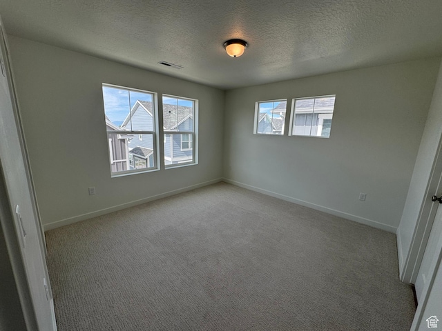 1668 N 1600 W Unit 128, Layton, UT 84041 - empty room with a textured ceiling and light colored carpet