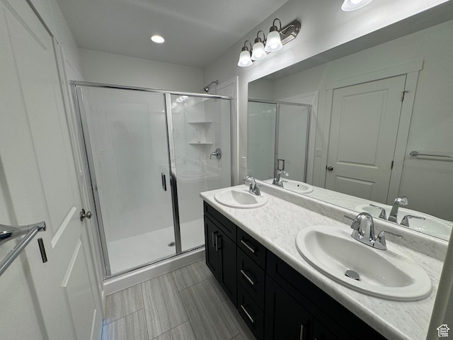 1668 N 1600 W Unit 128, Layton, UT 84041 - full bathroom with a stall shower and double vanity