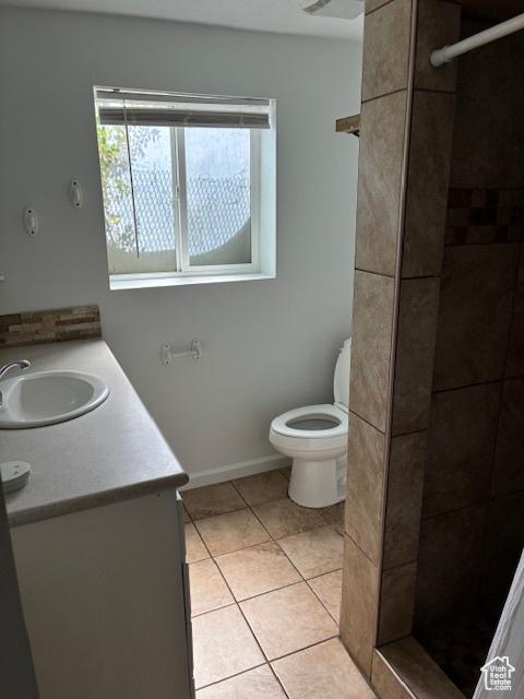 686 N 500 W, Orem, UT 84057 - bathroom featuring vanity, a stall shower, healthy amount of natural light, and tile patterned flooring