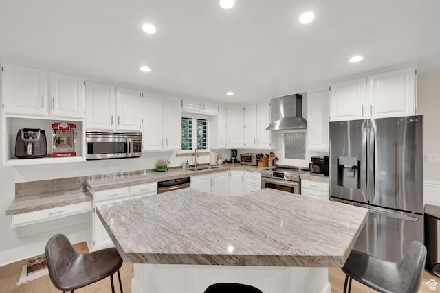 2345 E High Mountain Dr, Sandy, UT 84092 - kitchen featuring wall chimney range hood, stainless steel appliances, a kitchen bar, tasteful backsplash, and white cabinetry