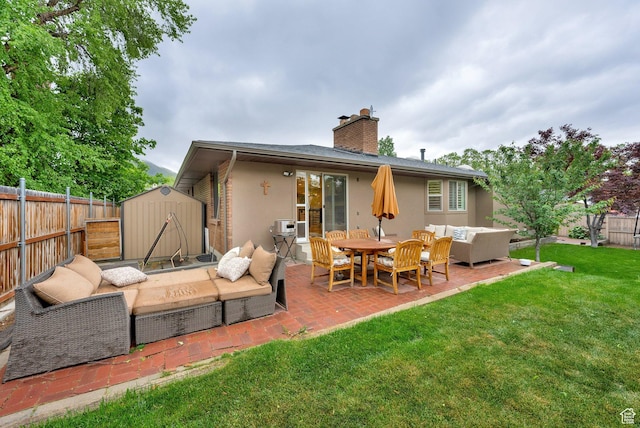 2345 E High Mountain Dr, Sandy, UT 84092 - back of house with an outdoor living space, a storage unit, a patio, a fenced backyard, and stucco siding