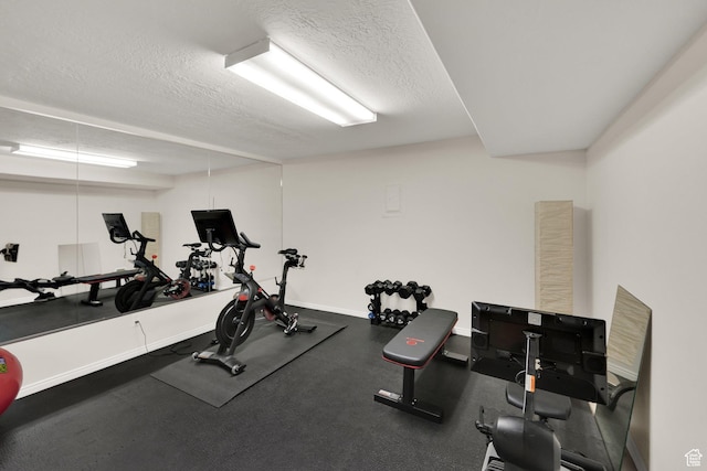 2345 E High Mountain Dr, Sandy, UT 84092 - workout area with a textured ceiling and baseboards