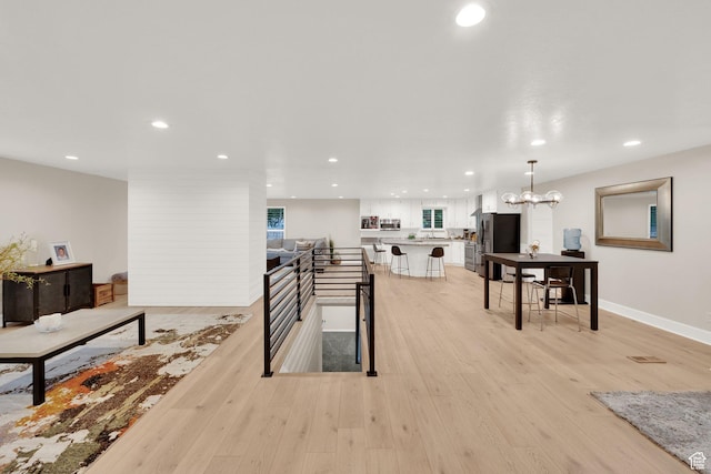 2345 E High Mountain Dr, Sandy, UT 84092 - living area featuring light wood-style flooring, recessed lighting, and a chandelier