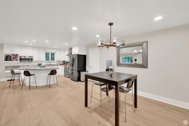 2345 E High Mountain Dr, Sandy, UT 84092 - dining room featuring light wood-style flooring, recessed lighting, and a chandelier