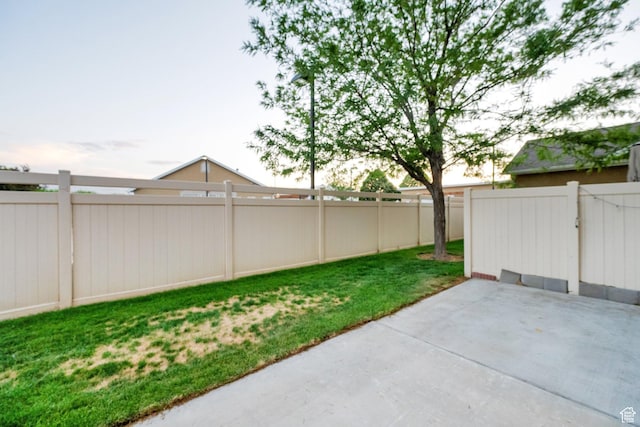 8728 S Black Diamond Cv W, West Jordan, UT 84081 - fenced backyard featuring a patio
