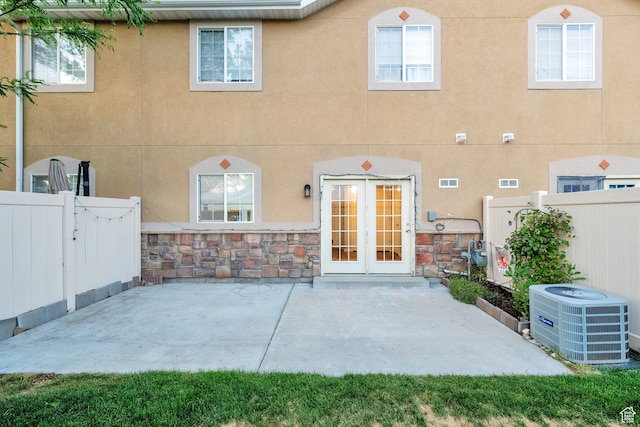 8728 S Black Diamond Cv W, West Jordan, UT 84081 - back of property with a patio area, stone siding, and stucco siding
