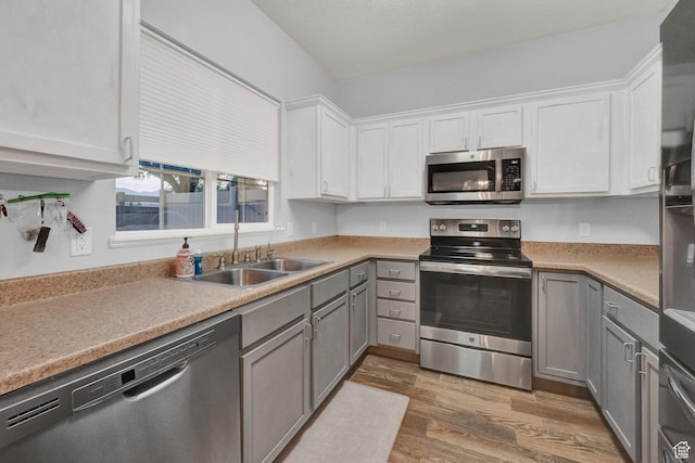 8728 S Black Diamond Cv W, West Jordan, UT 84081 - kitchen featuring stainless steel appliances, gray cabinets, wood finished floors, and white cabinets