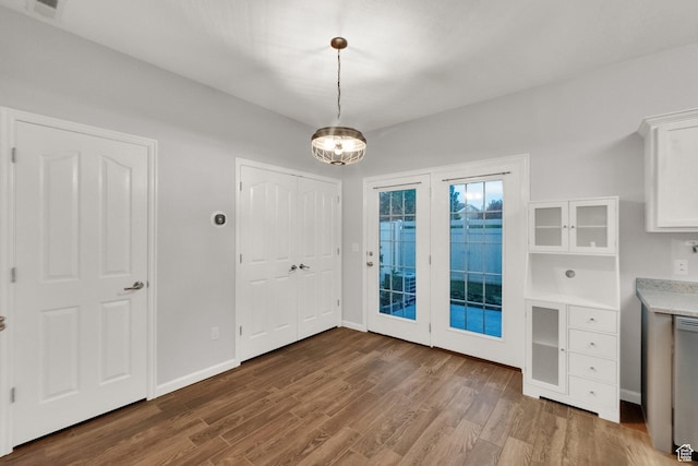 8728 S Black Diamond Cv W, West Jordan, UT 84081 - unfurnished dining area with wood finished floors and a chandelier