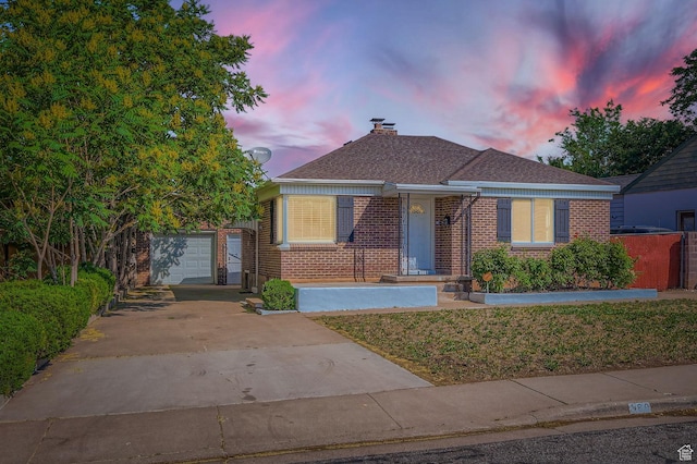 180 E Ross Dr, Clearfield, UT 84015 - bungalow featuring driveway, brick siding, a garage, a chimney, and an outdoor structure