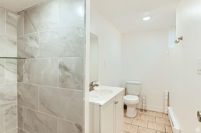 180 E Ross Dr, Clearfield, UT 84015 - bathroom featuring vanity, baseboard heating, and tile patterned floors