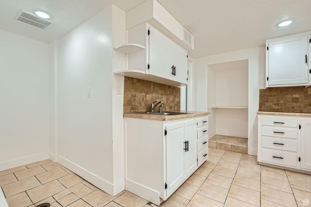 180 E Ross Dr, Clearfield, UT 84015 - kitchen featuring open shelves, light tile patterned floors, tasteful backsplash, light countertops, and recessed lighting