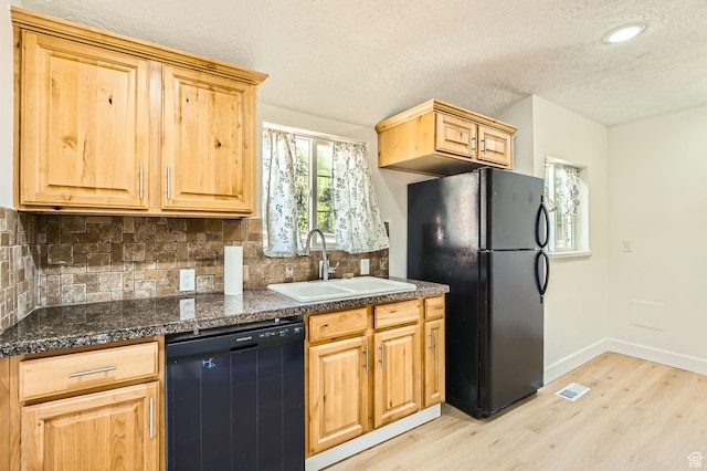 180 E Ross Dr, Clearfield, UT 84015 - kitchen featuring black appliances, light wood-type flooring, dark countertops, tasteful backsplash, and a textured ceiling