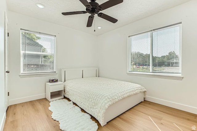 180 E Ross Dr, Clearfield, UT 84015 - bedroom featuring light wood finished floors, recessed lighting, and ceiling fan