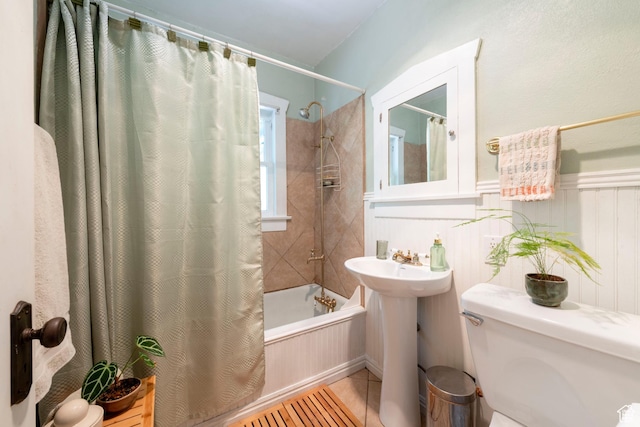 1021 E 800 S, Salt Lake City, UT 84102 - full bathroom with shower / tub combo with curtain, tile patterned floors, and wainscoting