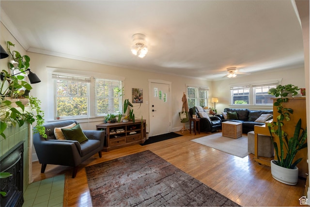 1021 E 800 S, Salt Lake City, UT 84102 - living room with wood finished floors, ornamental molding, a tile fireplace, and a ceiling fan