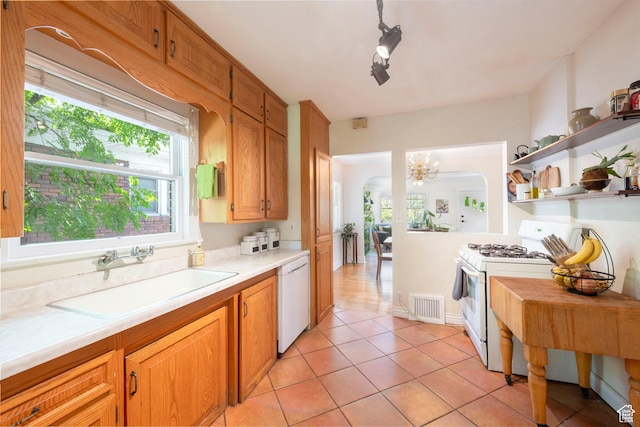 1021 E 800 S, Salt Lake City, UT 84102 - kitchen featuring white appliances, light countertops, light tile patterned floors, open shelves, and a chandelier