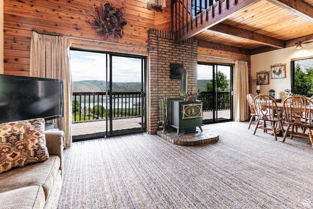 1922 N Corral Rd Unit 10, Scofield, UT 84526 - living room featuring wood walls, a wood stove, and a wood ceiling with exposed beams