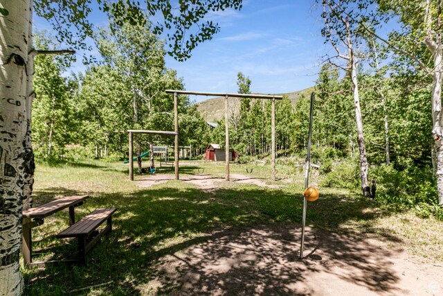 1922 N Corral Rd Unit 10, Scofield, UT 84526 - view of jungle gym featuring a storage shed, a yard, and a mountain view