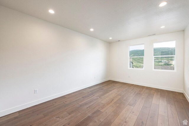 392 W Ascent Dr Unit 255, Hideout, UT 84036 - spare room with hardwood / wood-style floors and recessed lighting
