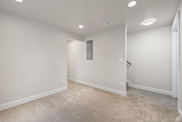 6959 S Adventure Way, West Jordan, UT 84081 - unfurnished room with electric panel, light carpet, and recessed lighting