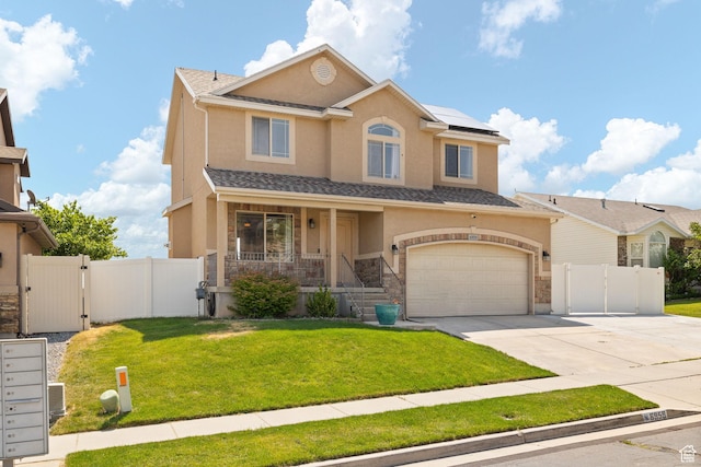 6959 S Adventure Way, West Jordan, UT 84081 - view of front facade with a gate, stone siding, a garage, concrete driveway, and stucco siding
