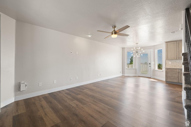 6959 S Adventure Way, West Jordan, UT 84081 - unfurnished living room featuring a chandelier, dark wood-type flooring, and a ceiling fan