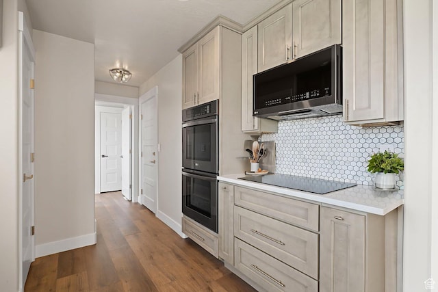 6959 S Adventure Way, West Jordan, UT 84081 - kitchen with double oven, black electric stovetop, light countertops, tasteful backsplash, and dark wood-type flooring
