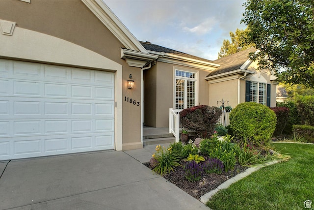 11863 S Cottage Side Way, Draper, UT 84020 - entrance to property featuring stucco siding, driveway, and a garage