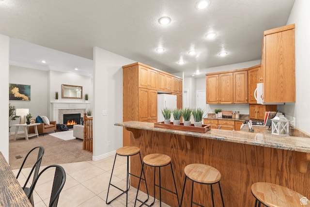 11863 S Cottage Side Way, Draper, UT 84020 - kitchen featuring white appliances, a peninsula, light colored carpet, recessed lighting, and light stone countertops