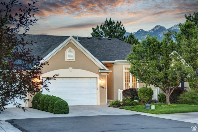 11863 S Cottage Side Way, Draper, UT 84020 - traditional-style house featuring stucco siding, driveway, a garage, a shingled roof, and a mountain view