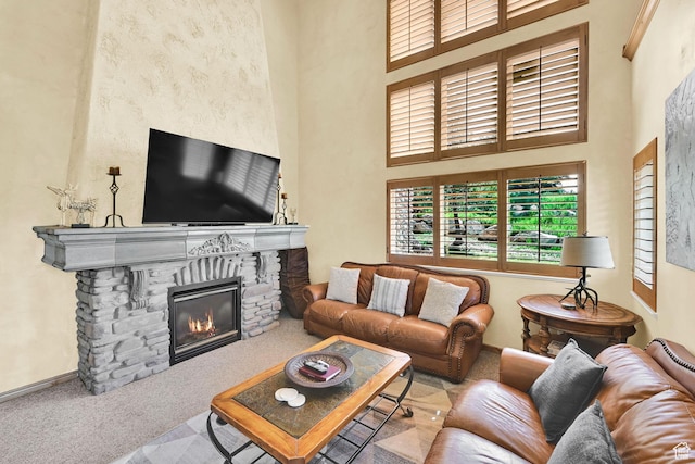 5176 E Fairview Loop Unit C505, Eden, UT 84310 - carpeted living room featuring a high ceiling and a fireplace