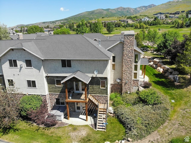 5176 E Fairview Loop Unit C505, Eden, UT 84310 - rear view of house with stairs, a patio area, stucco siding, a deck with mountain view, and stone siding