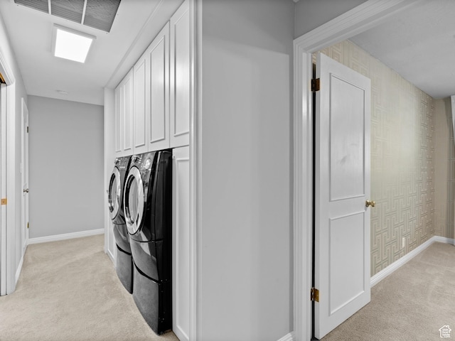 1150 E 2700 S Unit 50G, Salt Lake City, UT 84106 - laundry room with washer and clothes dryer, light colored carpet, and cabinet space