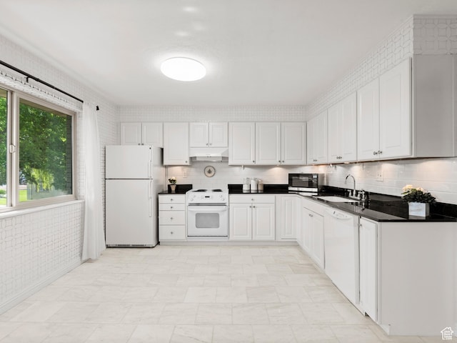 1150 E 2700 S Unit 50G, Salt Lake City, UT 84106 - kitchen featuring white appliances, under cabinet range hood, dark countertops, white cabinetry, and light floors