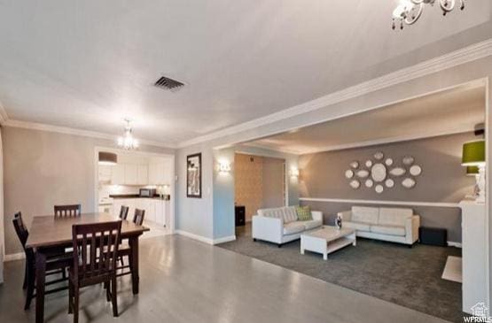 1150 E 2700 S Unit 50G, Salt Lake City, UT 84106 - dining area featuring a chandelier and crown molding