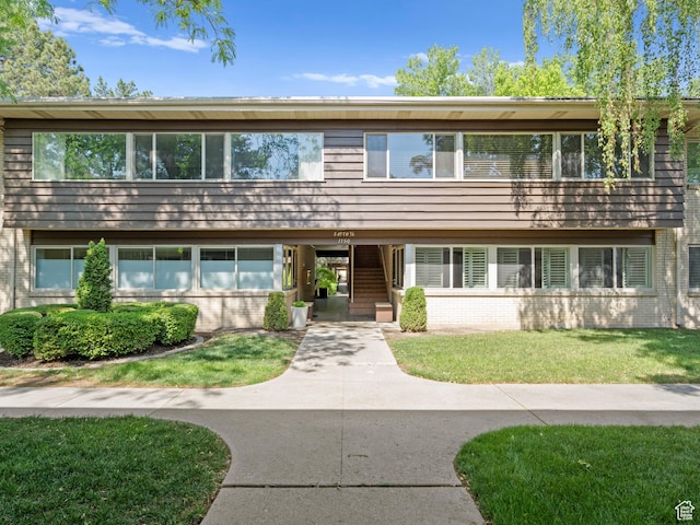 1150 E 2700 S Unit 50G, Salt Lake City, UT 84106 - view of front of house with brick siding and a front lawn