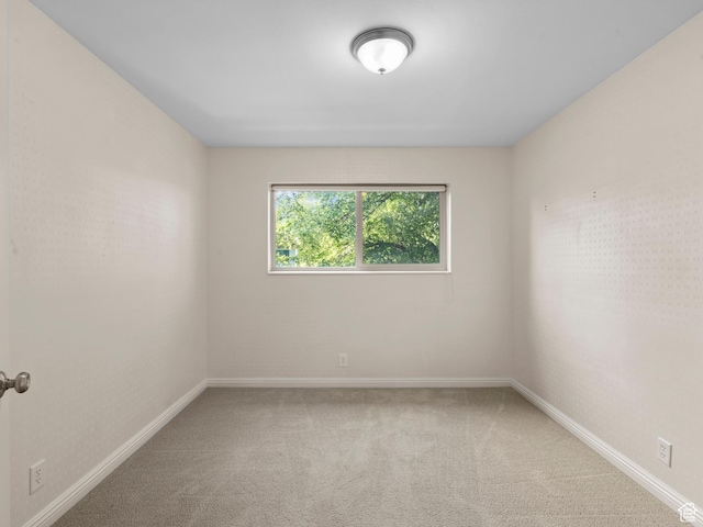 1150 E 2700 S Unit 50G, Salt Lake City, UT 84106 - carpeted spare room featuring baseboards