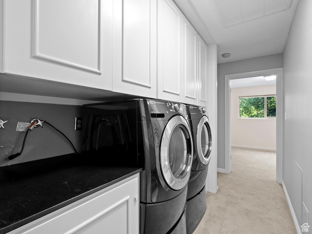1150 E 2700 S Unit 50G, Salt Lake City, UT 84106 - laundry room featuring light colored carpet, washer and clothes dryer, and cabinet space