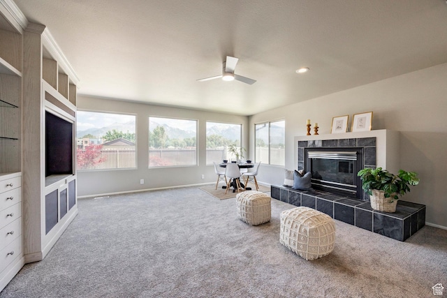 8097 S 535 E, Sandy, UT 84070 - carpeted living room with ceiling fan, a tiled fireplace, and recessed lighting