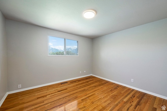 8097 S 535 E, Sandy, UT 84070 - empty room featuring baseboards and light wood-type flooring